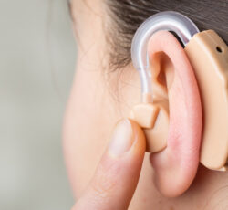 Close Up,of,hearing,aid,in,the,ear,of,a,girl